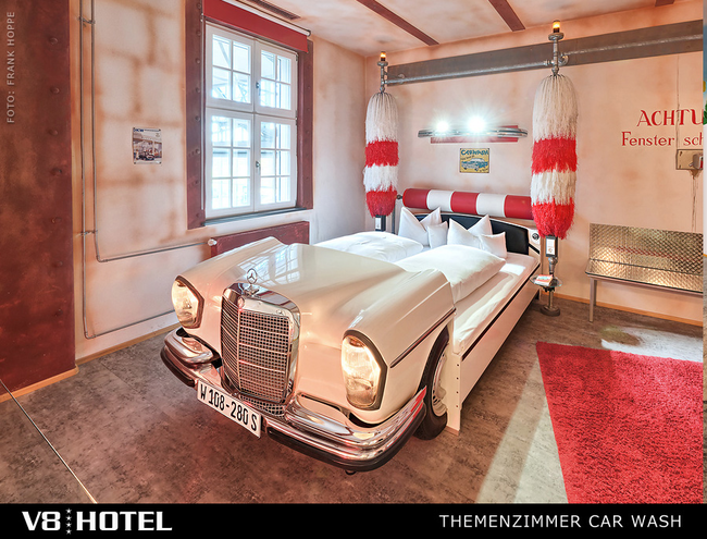 Who says you're too old for a car bed? Everyone? Well, not at the V8 Hotel. This hotel is entirely car-themed, with rooms designed around classic, vintage, and modern autos.
