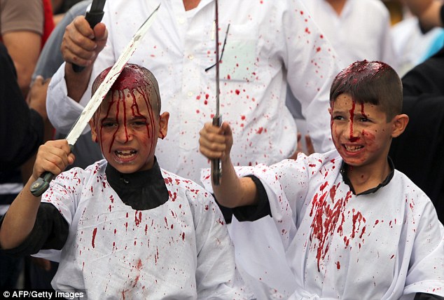 Young children were seen covered in their own blood as they wielded large blades in a ceremony in Baghdad