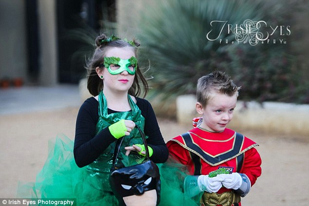 Breaking with tradition: The flower girl, dressed as a mini Poison Ivy, walked down the aisle with the Power Ranger ringbearer