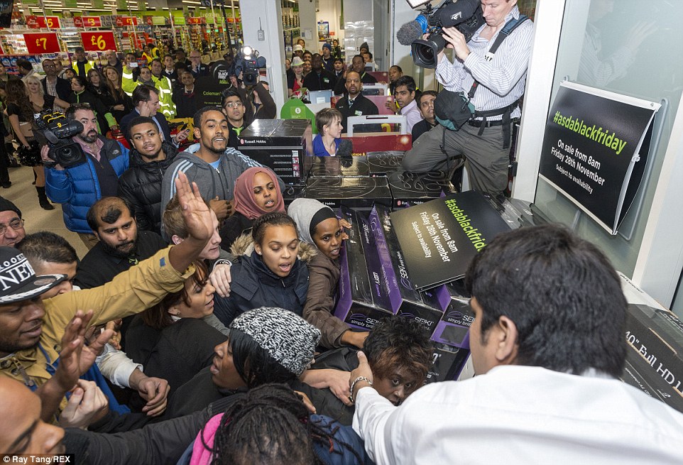 More customers fight over discounted televisions at the Asda store in Wembley, north London. Despite the chaos no arrests were made 