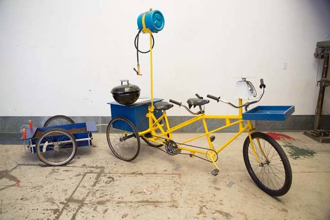 Not only does this tandem bike have a grill, there's also a water reservoir and a working hose.