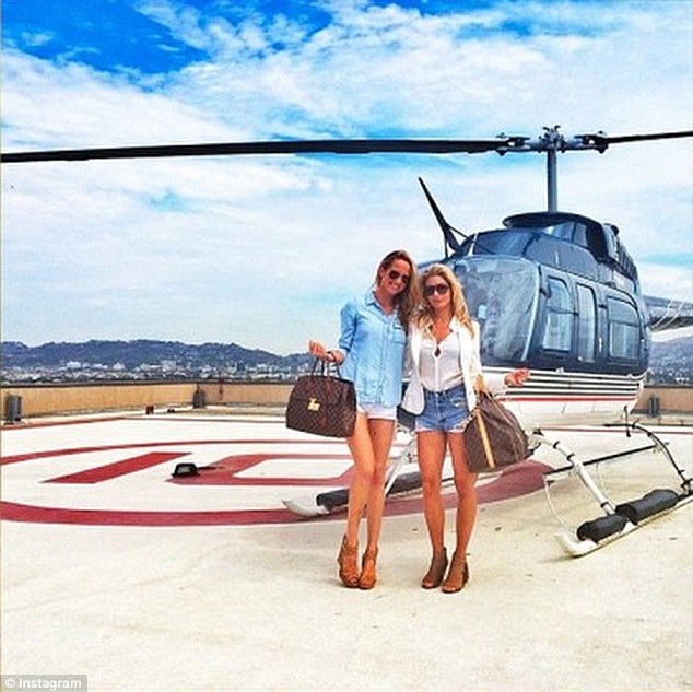 Tally-ho! Before jumping on their helicopter ride, these girls stopped for a quick snap in the blazing sun
