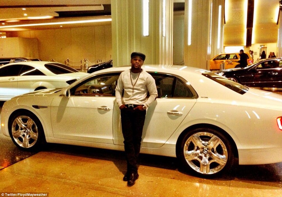 Mayweather was leaning against a Bentley Flying Spur back in 2013 when he posted the message: 'Enjoying my night' 
