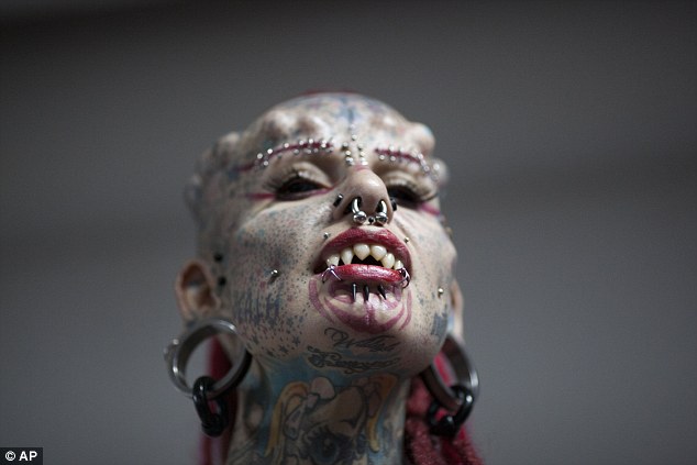 Ms Cristerna, pictured, has heavily modified her teeth to fit in her her vampire-inspired image