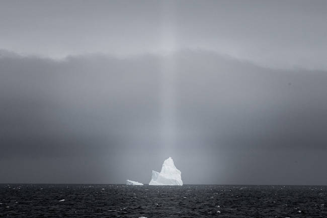 This is how icebergs are typically seen, as white, floating masses of ice on the water.