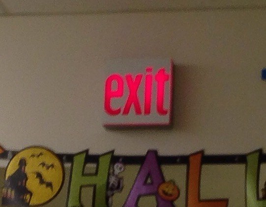 An exit sign in lowercase for no apparent reason.