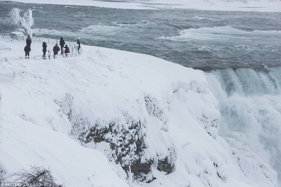 Visitors view Niagara Falls in sub freezing temperatures