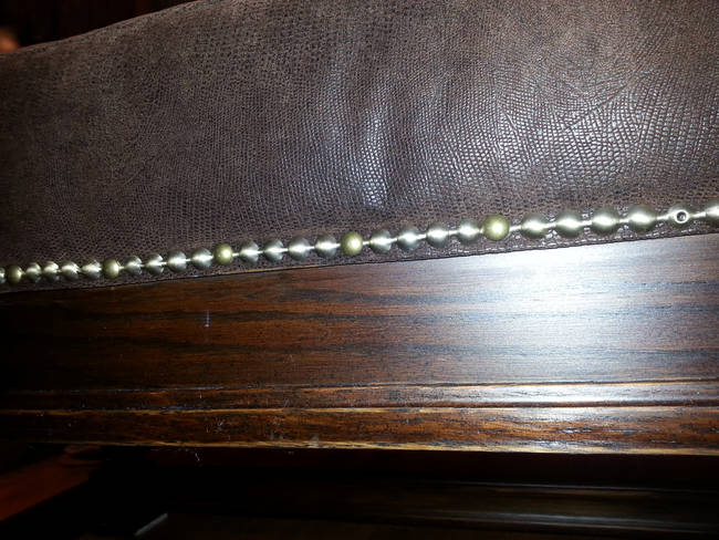 For an extra touch, a tack trim lined the edges of the ottoman.