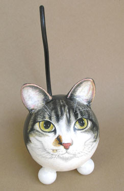 There's <a href="http://www.custompeturns.com/catferril.html" target="_blank">a company</a> that makes urns that essentially take the likeness of your pet and contorts his shape into that of a Furby. I'm told it's very popular with the kids.