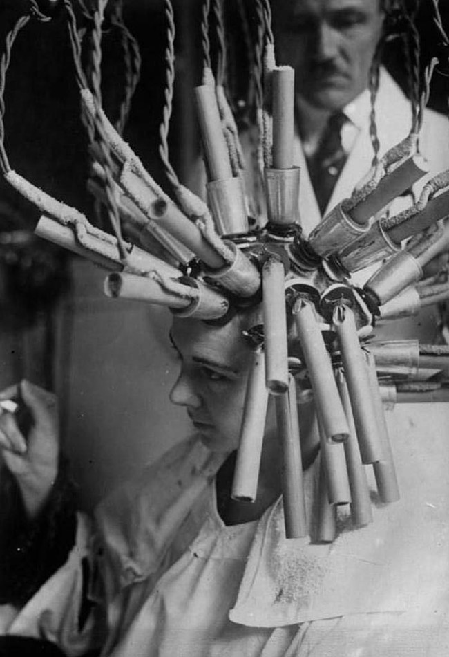 This woman is undergoing a permanent hair procedure in 1929 Germany.