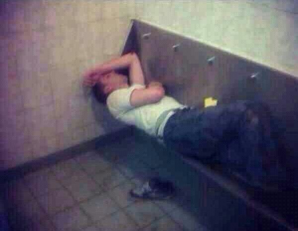 Using a spacious urinal as bed.