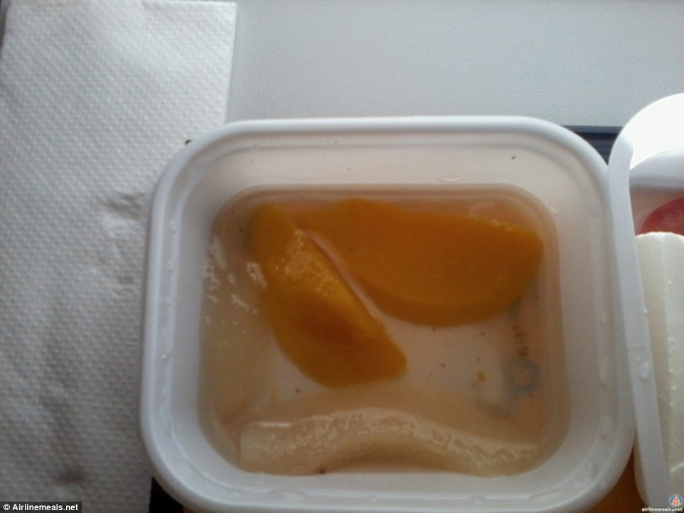 You would be forgiven from thinking this slimy peach dessert was a slug. It is fact the dish on offer onboard a Ukraine International flight