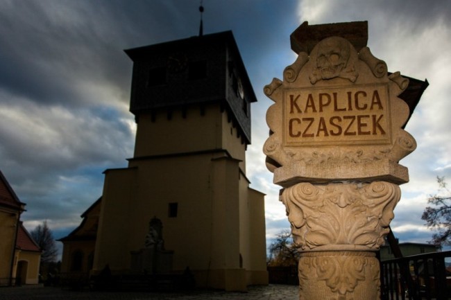 The church is also known as <em>Kaplica Czaszek, </em>literally translating to "Skull Chapel." That should tip you off as to what you might walk into.