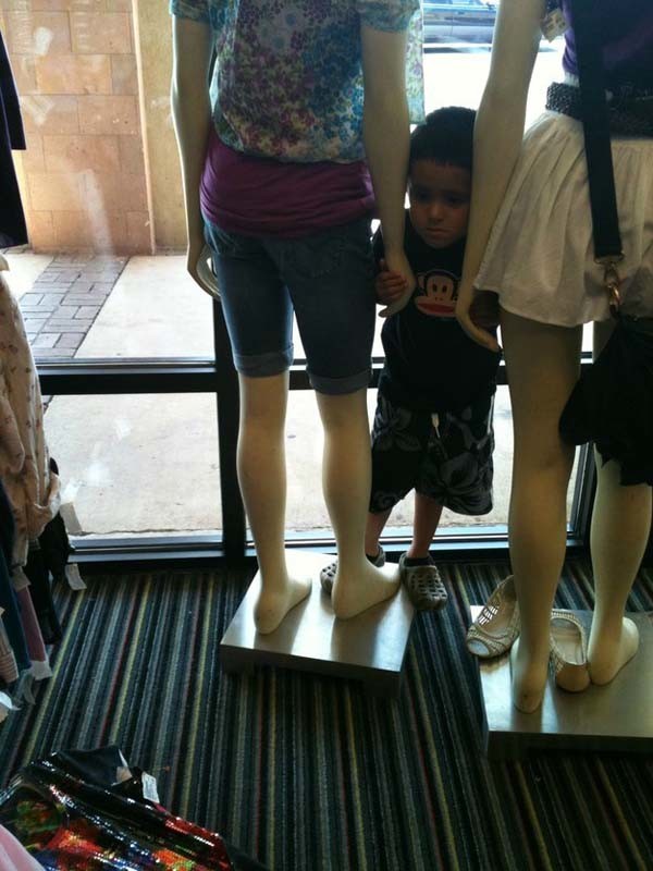 Not even the mannequins can comfort this kid.