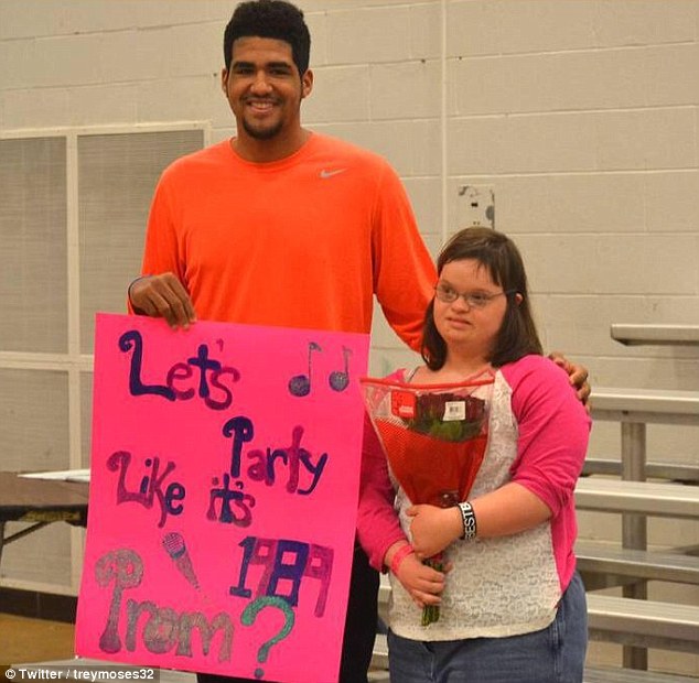 Heading to prom: Trey Moses, a senior at Eastern High School in Louisville, Kentucky who will play for Ball State next year, asked Ellie Meredith to be his date to the upcoming prom - and she accepted