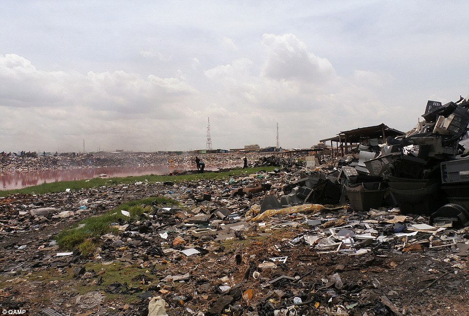 Dumped: E-waste graveyards in Africa (pictured) are damaging the health of the scavengers and the local environment, according to a United Nations University report