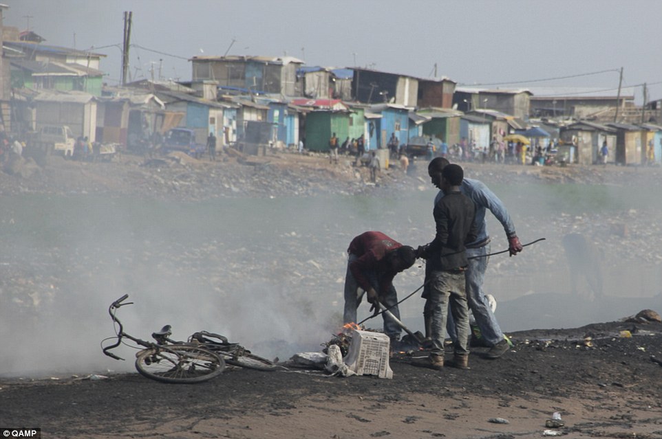 Aid: UNU believes legal shipments of electronic appliances can help people in Africa who burn components (pictured) to extract scrap metal which they can sell