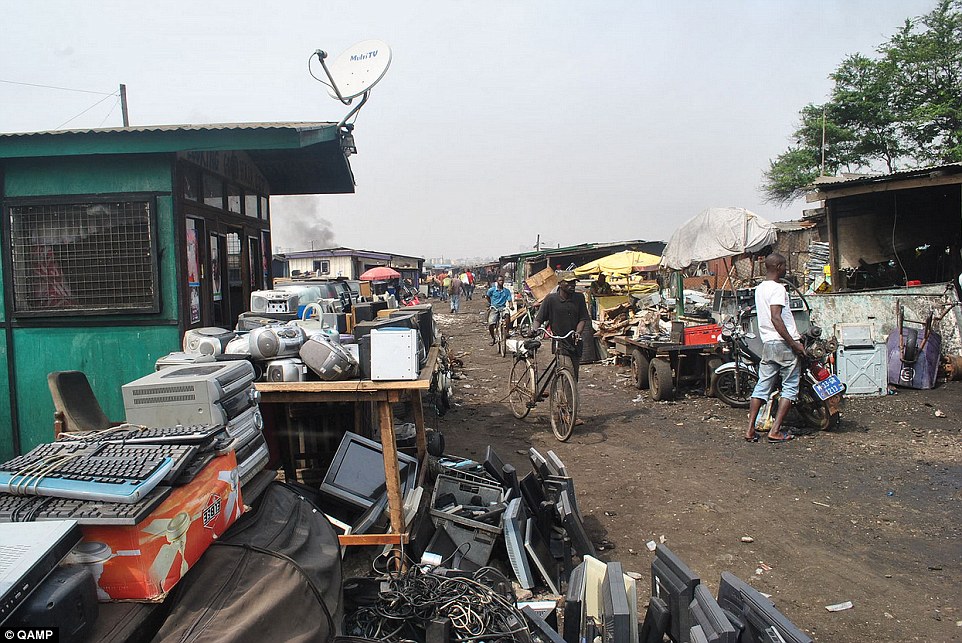 Profit: Locals in Ghana's capital Accra intercept trucks carrying the discarded products and buy the products without testing them - to later sell them in the city's market (pictured)