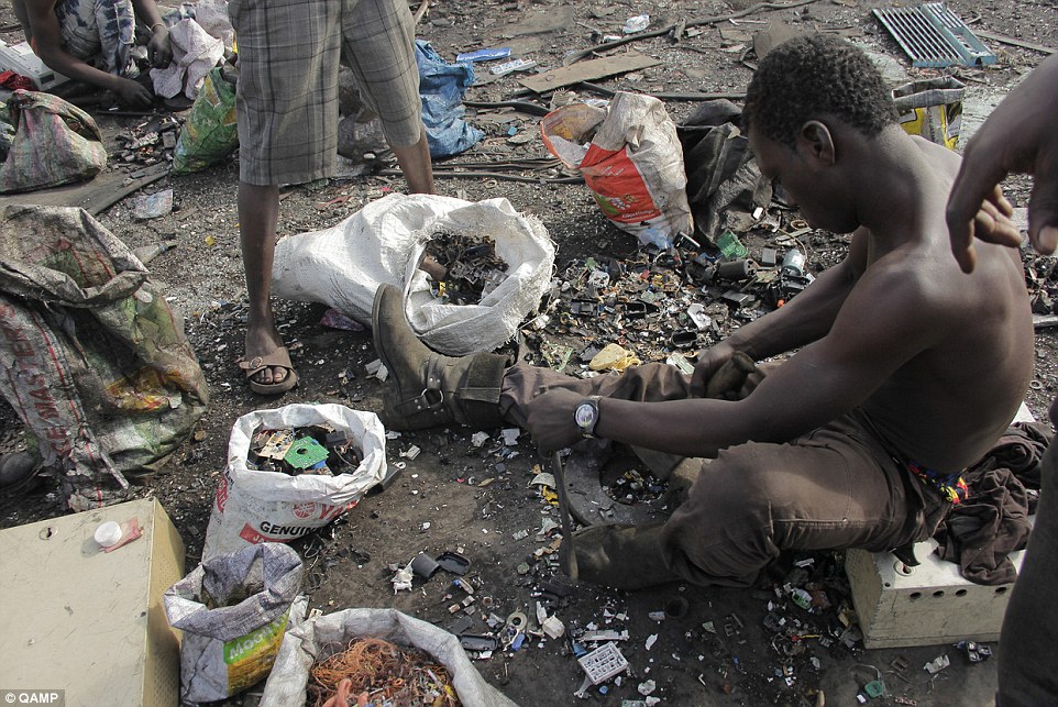 Dangerous: Young men sift through the mountains of scraps in landfills like Agbogbloshie (pictured), hoping to find something worth selling in local markets