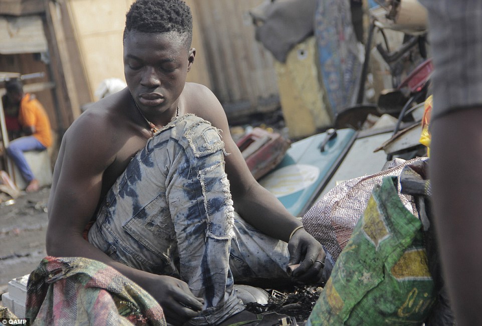 Danger: Young men brave toxic fumes and explosive appliances in Agbogbloshie (pictured), in what one local journalist calls 'the chaotic heart of one of west Africa's biggest economies'