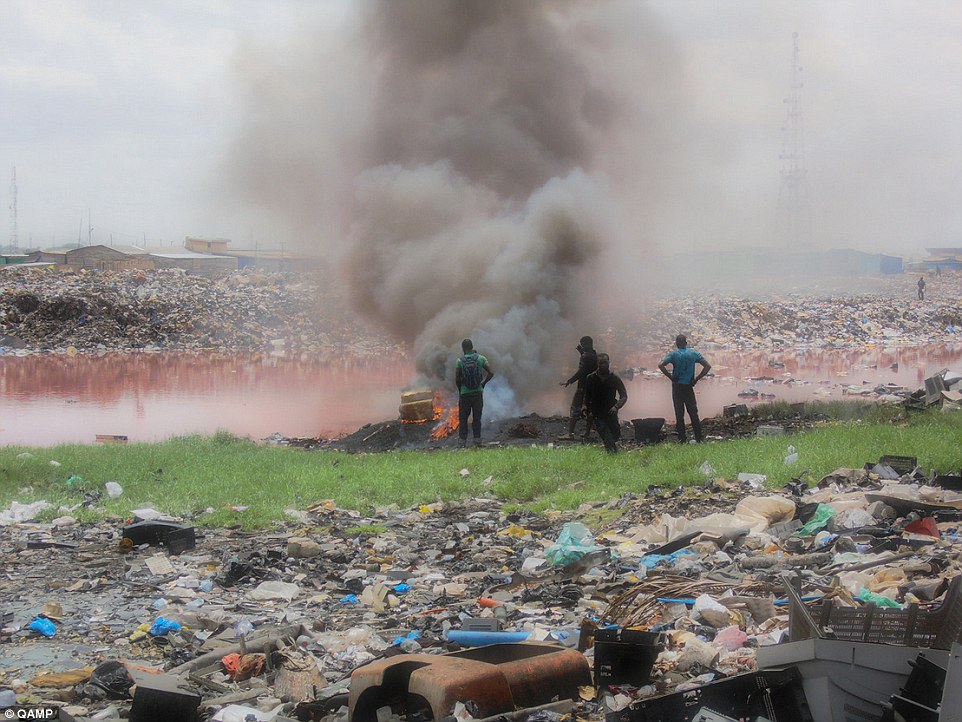 Polluted: 'Millions of tonnes' of the world's e-waste ends up in Africa where it is dumped in landfills like Agbogbloshie (pictured) in Ghana's capital Accra