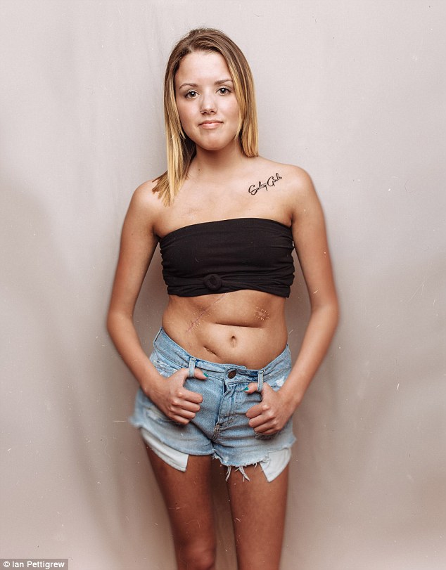 Casual look: A woman with 'Salty Girls' written on her shoulder donned a black bandeau top and denim cutoffs for her portrait 