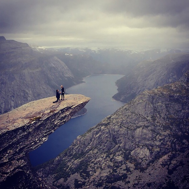 Proposing On Trolltunga After A 9 -Hour-Long Hike. "As I was looking at the camera Connor tugged my hand, when I turned around he was on one knee."