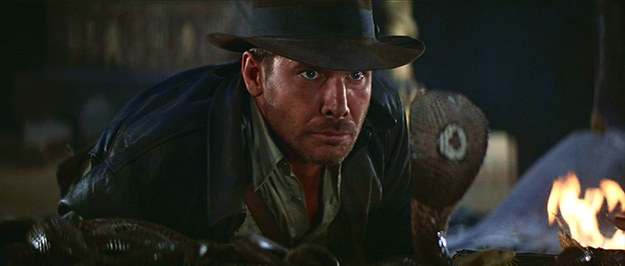 In Raiders of the Lost Ark you can see the snake's reflection in the glass separating it from Indiana Jones.