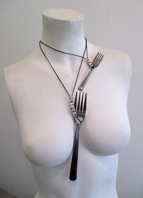 A pair of fork friendship necklaces that say "Father" and "Son."