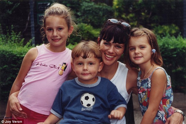 Happiness: Joy Veron and her three children, L-R: Chloe, 7, Elliot, 2, Annie, 5, in 1999, before the tragic accident that left Joy unable to walk. She threw herself underneath the wheels of a runaway SUV to stop it rolling over a cliff with her children inside