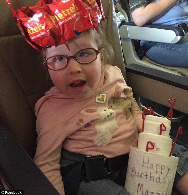 Delighted: Mazzy was tickled pink with her birthday surprise last month thanks to Southwest Airlines and received a crown made from pretzels and a cake made from toilet paper 