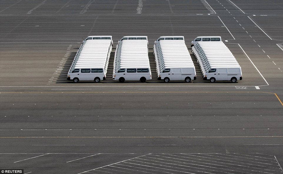 Not a glitch in the Matrix: A number of Nissan vehicles are parked at the company's factory in Yokosuka, south of Tokyo, Japan, in November 2009
