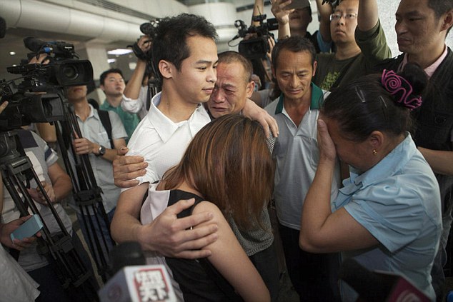 Members of Zheng's family embraced him after they saw him for the first time in almost two decades 