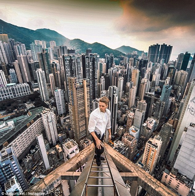 Globetrotter: Oleg has scaled skyscrapers, bridges and towers all over the world, including Hong Kong (pictured) 