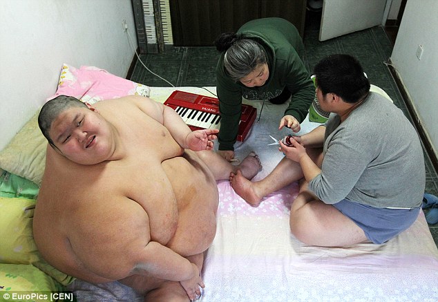 Ma Zhiqiu, 47, gave birth prematurely to twins Zhang Hangjun and Zhang Yuanjun 21 years ago. Images showing the single mother's two-decade struggle to raise her sons, who both suffer from both autism and cerebral palsy, have moved hearts around the globe
