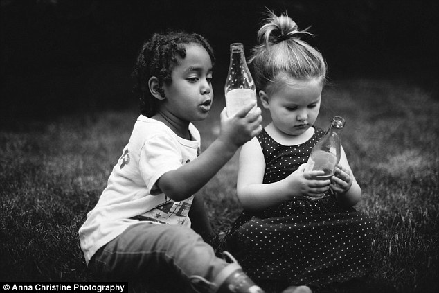 Sweet friendship: Semenesh and Haven enjoy a sweet drink together as they sit and play 