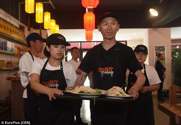 A restaurant has opened in China offering jobs to those with learning difficulties. They will be working as waiters alongside regular workers