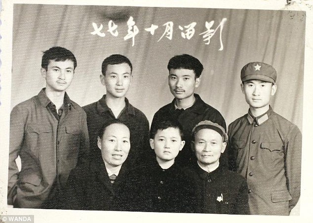Service: Wang Jianlin (pictured far right) - the eldest of five brothers (pictured) - followed in his father's footsteps by joining the People's Liberation Army