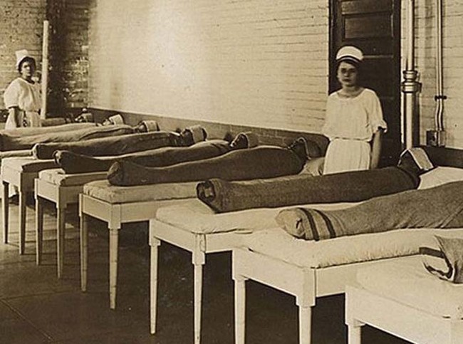 Here's one of the many bizarre, unfortunate ways that doctors used to treat the mentally ill. Each patient here is wrapped in a wet sheet.