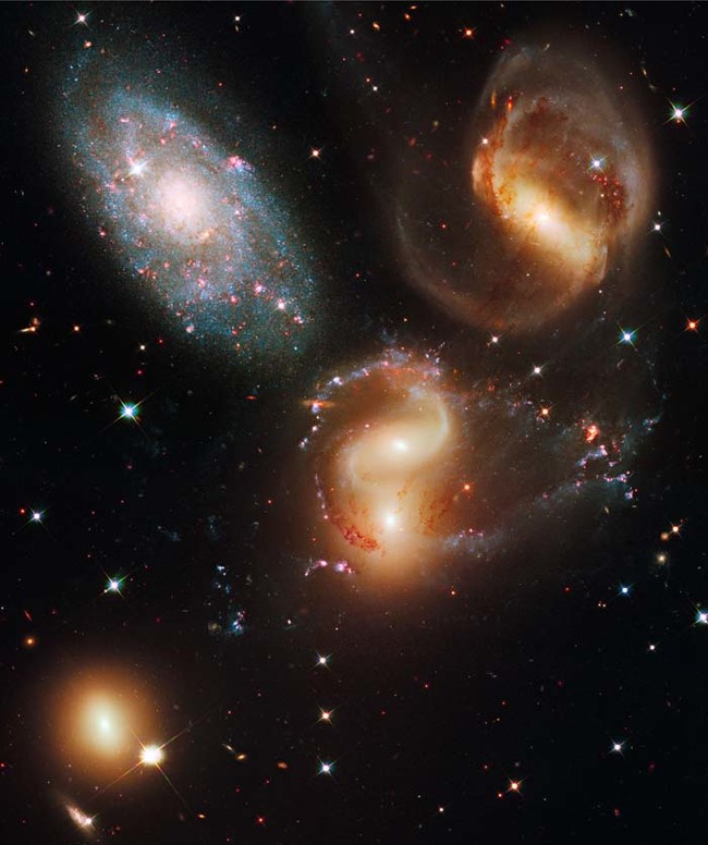 This is a cluster of five galaxies known as Stephan's Quintet, or the Hickson Compact Group 92. 