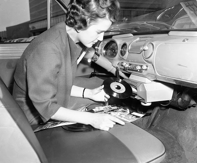 The International Industrial Fair in Hannover, West Germany, in May 12, 1959. The "Auto Mignon" was a record player that could be attached to the dashboard.