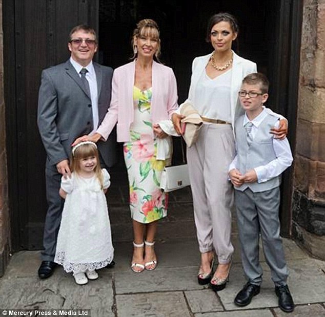 Sharon Green, pictured centre, at the christening of her three-year-old daughter Tahlia-Rose with husband Chris,  daughter  Rhiannah, 20, and 10-year-old Tomas. They refused to serve the 'offensive' cake