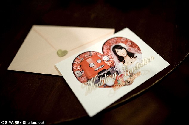 Special invitations were made, which featured a picture of the two robots inset in a heart