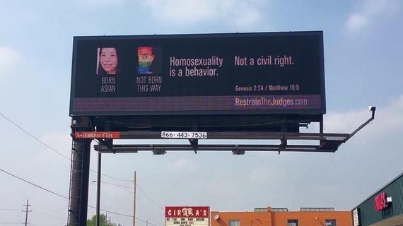 Campaigners raised money to place the ad on the billboard because the sign also features this decidedly anti-gay ad: