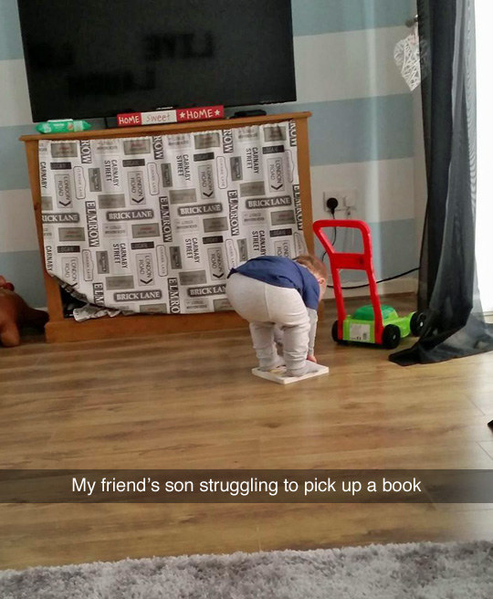 Trying to get your life together is a lot like this kid trying to pick up a book: