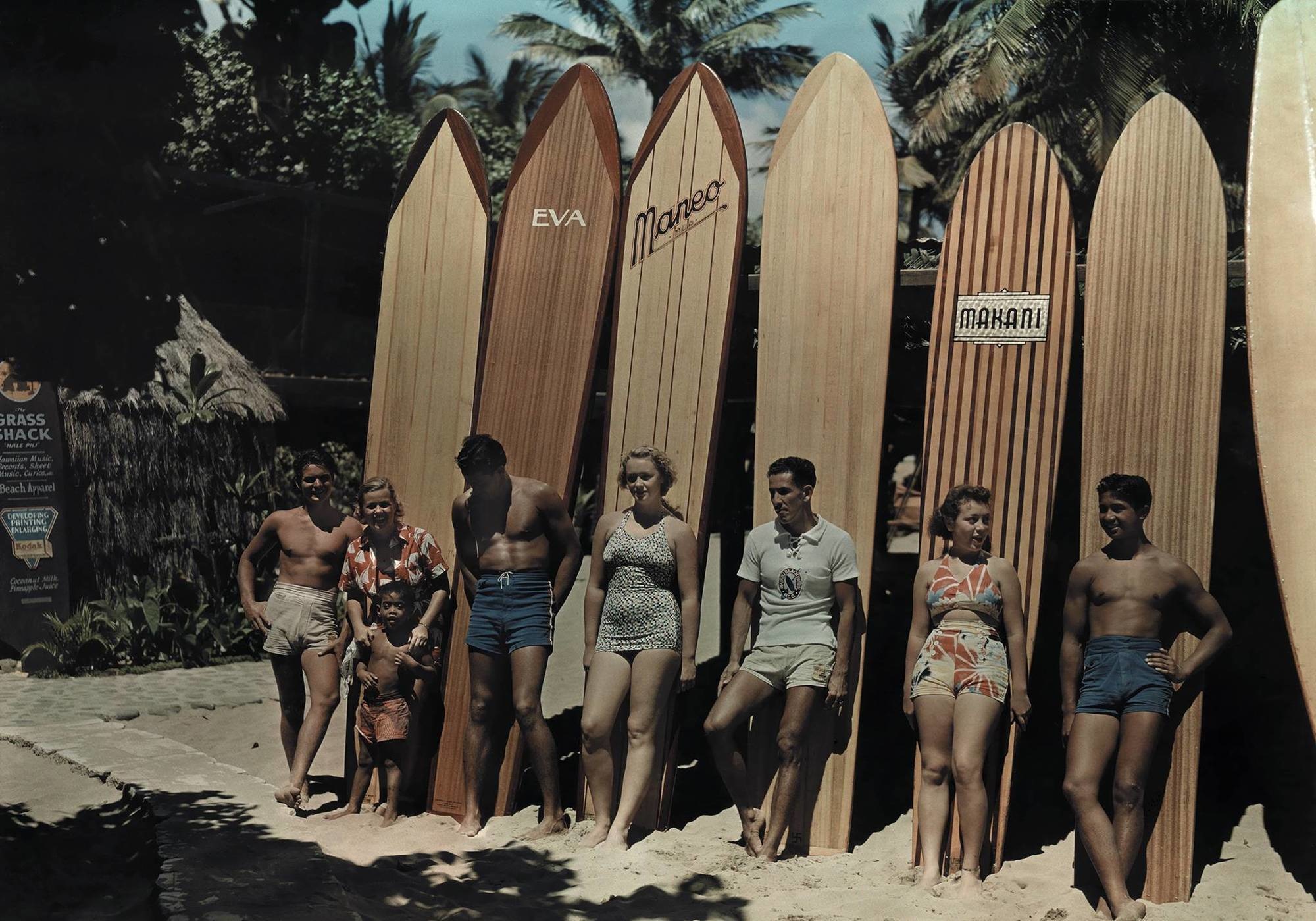 1937 surfers pose in front of their awesome wooden surf boards in Honolulu, Hawaii. This was before the advent of fiberglass boards, and these often weighed more than 100 pounds.