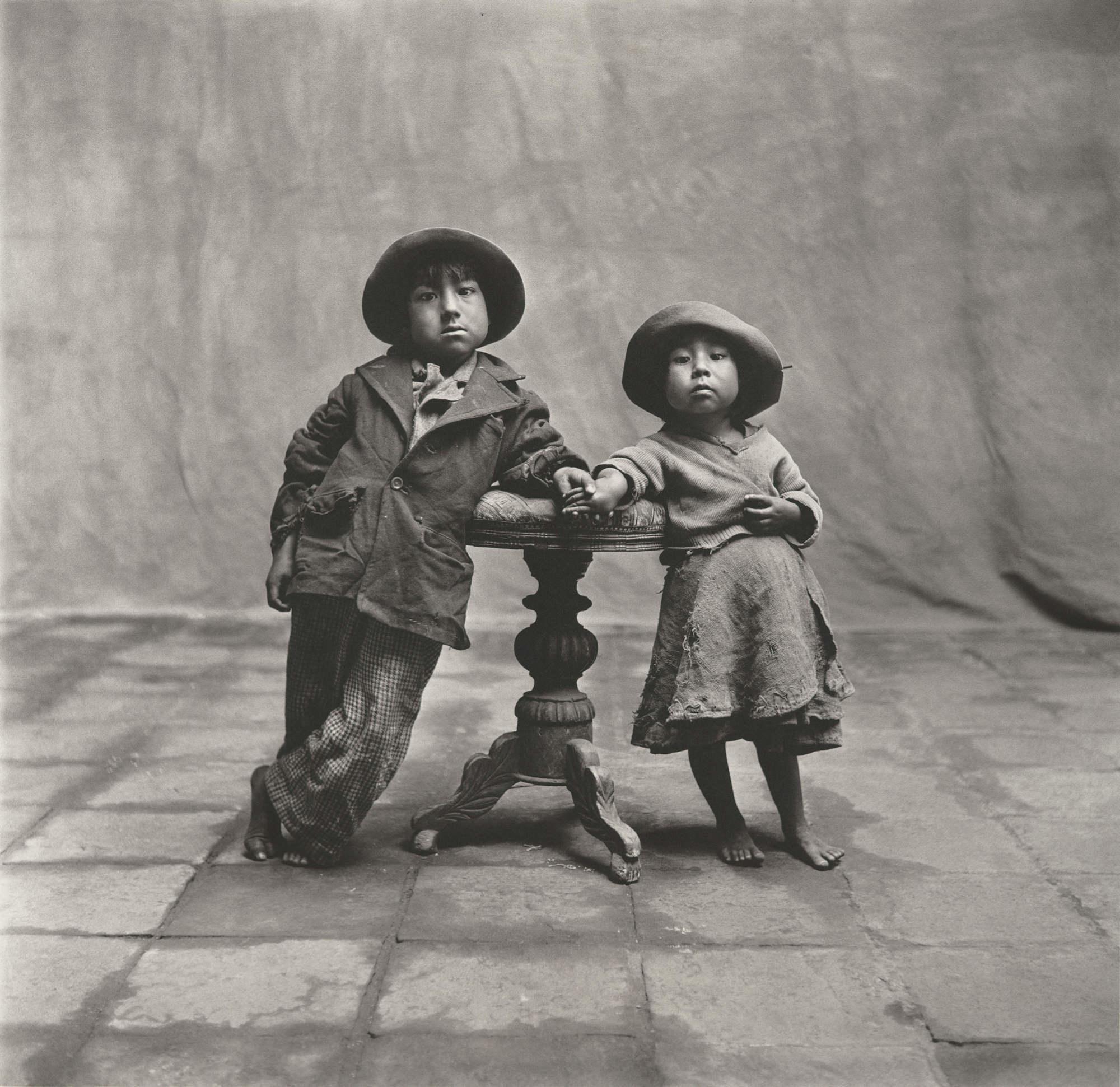 Two children from Cuzco, Peru, have their (very dignified and awesome) portrait taken.