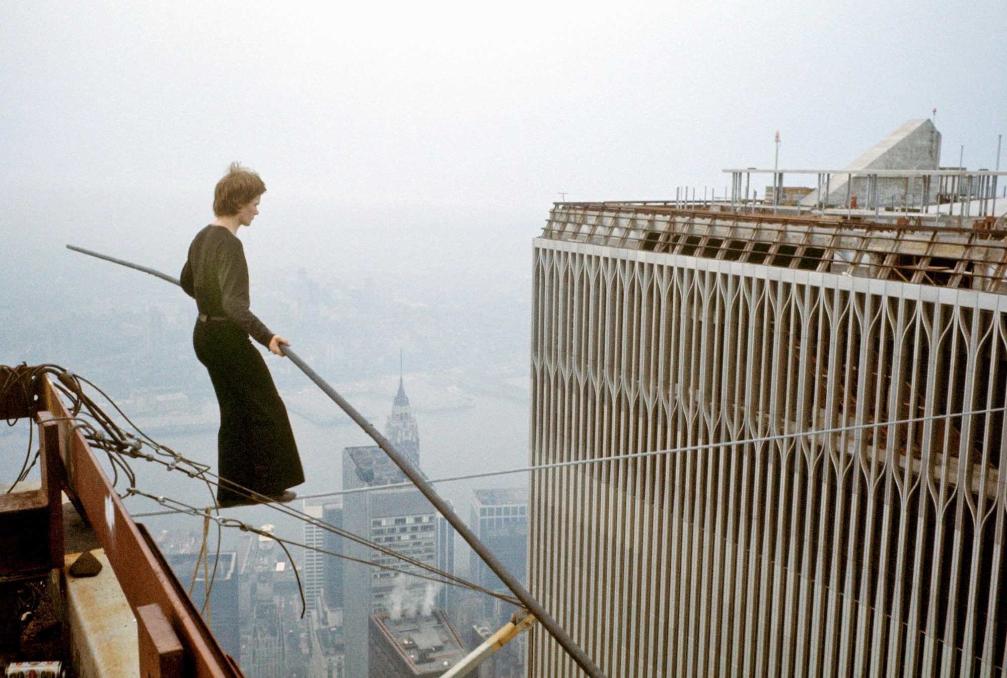 Philippe Petit, a tightrope walker, going for an early stroll through -or should we say over - lower Manhattan.