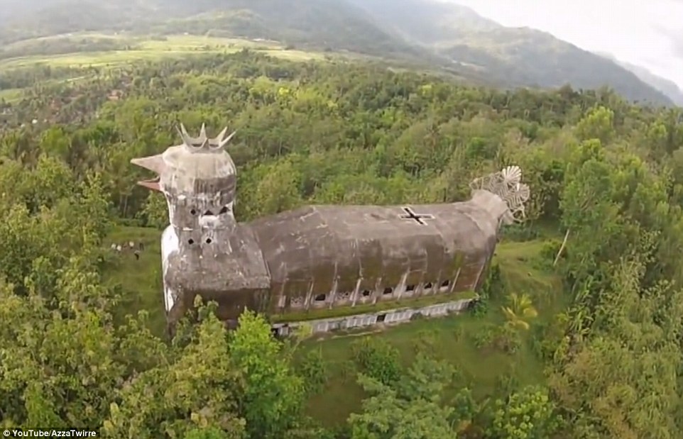 Majestic: The giant building known locally as Gereja Ayam - or Chicken Church - stands over the trees in a densely wooded area in Indonesia