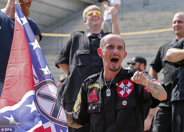 Fury: A member of a white supremacist group yells at opposing protesters during clashes between the KKK and the New Black Panther Party on July 18, shortly after the tuba serenade